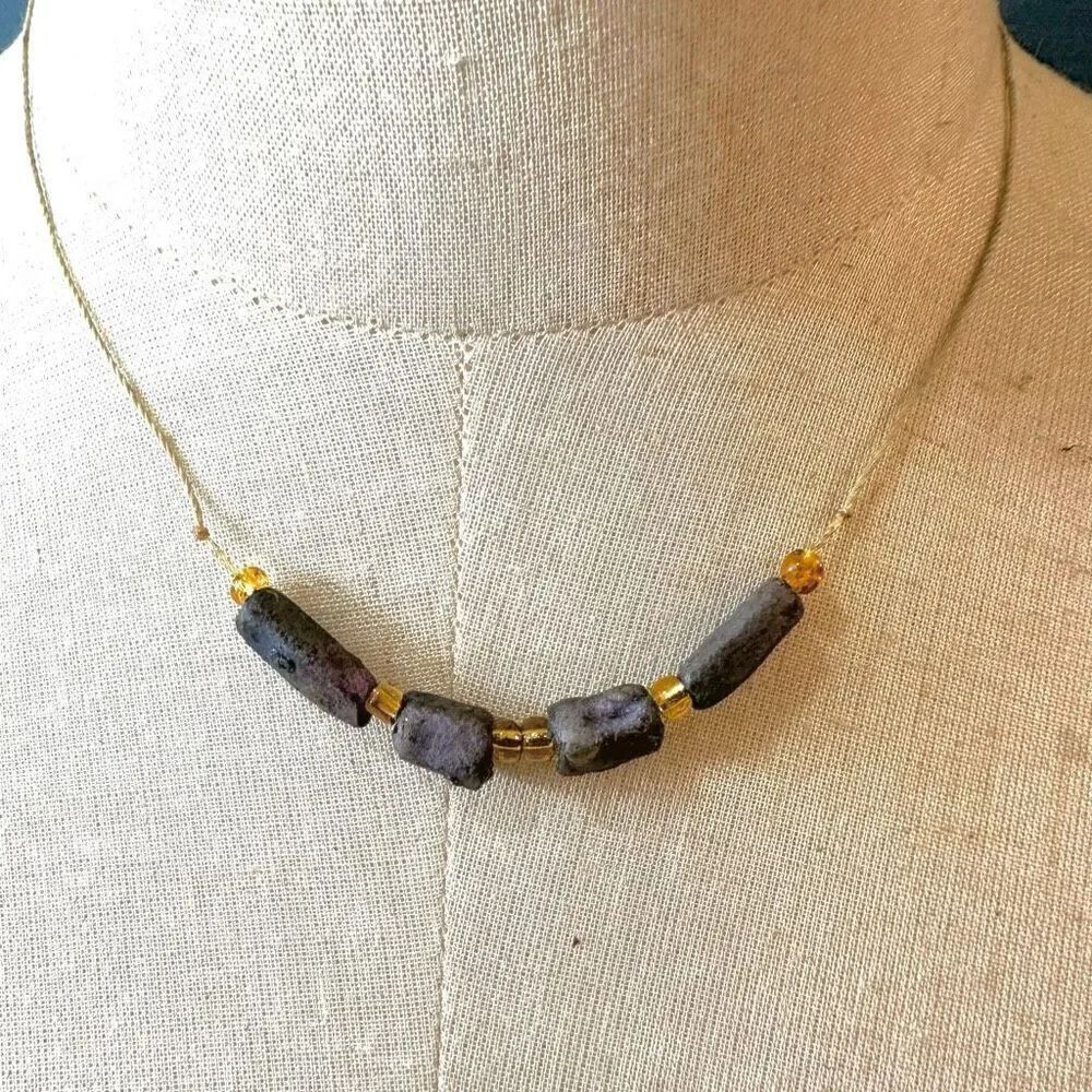 Purple beaded necklace  on cord